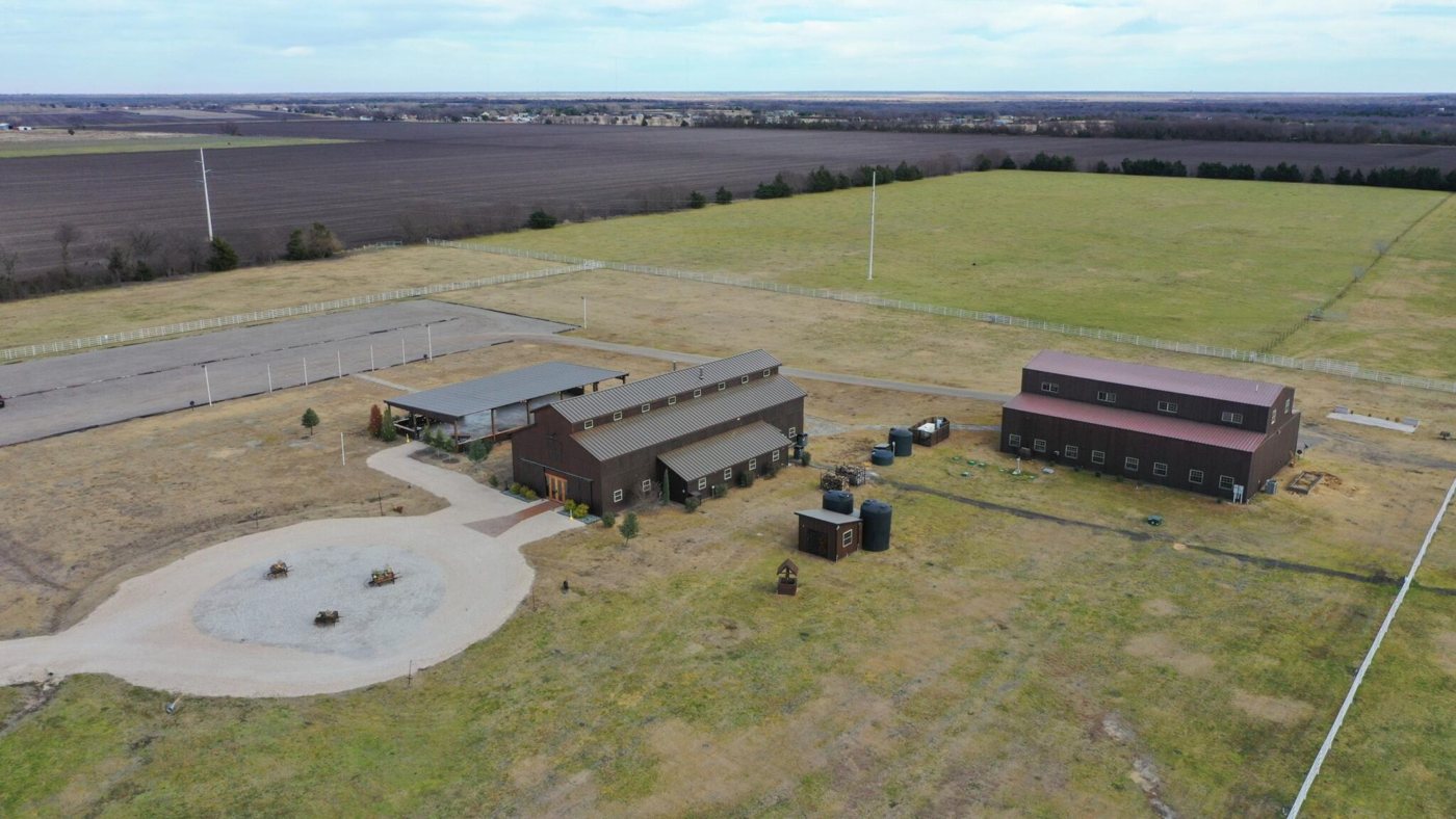 Aerial showing ranch buildings and crew vehicle parking